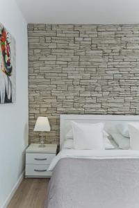 Ένα ή περισσότερα κρεβάτια σε δωμάτιο στο Hvar Pavičić Top View apartments