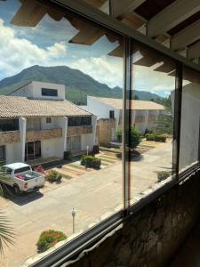 a view from a window of a parking lot at Caribbean Loft near Playa El Agua in El Salado
