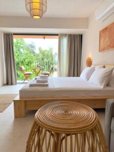 a bedroom with a large bed and a table at Rue Rooms in Fethiye +21 photos
