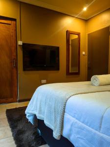 Postel nebo postele na pokoji v ubytování Mukani Guesthouse