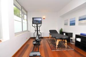 a camera on a tripod in a room with a tv at Eco Hotel Cleofe in Caorle