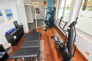a gym with two treadmills and a treadmill at Eco Hotel Cleofe in Caorle
