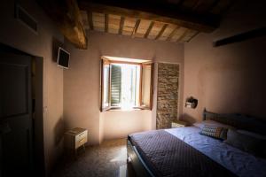 Postel nebo postele na pokoji v ubytování Il Vicoletto di BIBI - B&B