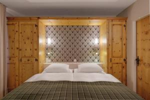 Postel nebo postele na pokoji v ubytování Morosani Posthotel