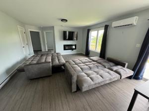 a large living room with a large bed and a couch at The Berkshire Home in Sydney
