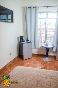 TV a/nebo společenská místnost v ubytování pineapple hospitality