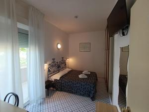 A bed or beds in a room at Hotel Le Terrazze