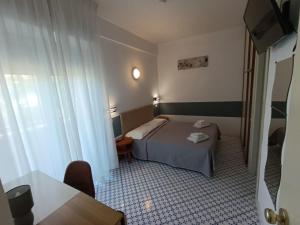 A bed or beds in a room at Hotel Le Terrazze
