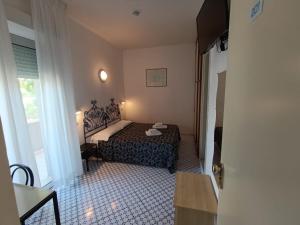 A bed or beds in a room at Hotel Le Terrazze