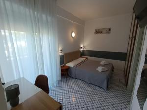 A bed or beds in a room at Hotel Le Terrazze
