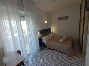 A bed or beds in a room at Hotel Le Terrazze