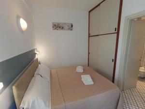 A bed or beds in a room at Hotel Le Terrazze