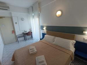 A bed or beds in a room at Hotel Le Terrazze