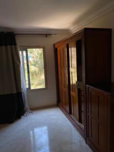 an empty room with a door and a window at Bianchi Hotel in Alexandria