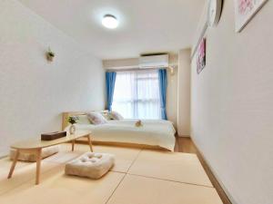 Tempat tidur dalam kamar di J5-東京中心 駒込駅4分近商业街 4mins to ST Max 4P 直达新宿 渋谷 表参道 池袋 上野 代代木 銀座 原宿