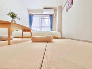 Tempat tidur dalam kamar di J5-東京中心 駒込駅4分近商业街 4mins to ST Max 4P 直达新宿 渋谷 表参道 池袋 上野 代代木 銀座 原宿