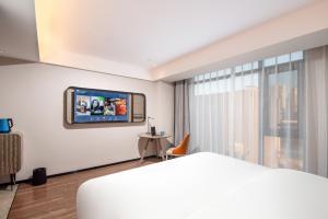Foto Wenshanis asuva majutusasutuse Echarm Hotel Wenshan galeriist
