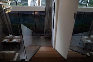 a dining room with a table and a window at Deluxe apartments Canggu area with gym coworking security parking and full services in Tumbak Bayuh