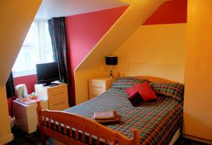 Postel nebo postele na pokoji v ubytování Atticus Central Guest House