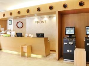 a front desk of a store with at Island Hotel in Nagano