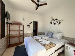 Postel nebo postele na pokoji v ubytování Pousada Villa Real Paraty - Localização e café da manhã EXCELENTES"