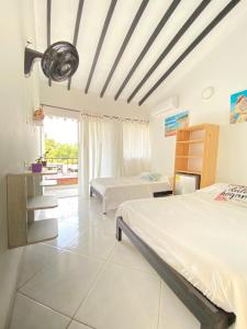 Postel nebo postele na pokoji v ubytování Eco Hotel El Acuario