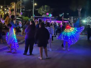 a group of people standing in the street at night at Key Largo Paradise in Key Largo +85 photos