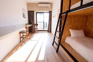Voodi või voodid majutusasutuse Chao Hostel toas
