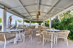 A restaurant or other place to eat at Sirocco Hotel