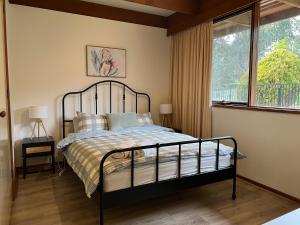a bedroom with a bed and a window at Willunga Cottage — Sweet Country Retreat in Lyndhurst South +36 photos