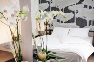Ліжко або ліжка в номері Hotel Internazionale Bellinzona