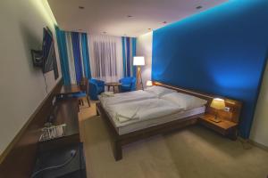 Posteľ alebo postele v izbe v ubytovaní Hotel Arkada