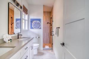 a white bathroom with a sink and a toilet at Searenity Now Depoe Hills in Depoe Bay +51 photos