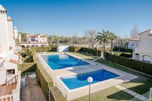 a swimming pool in the backyard of a house at Casa Azahara by MarCalma in El Casalot