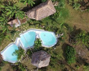 A view of the pool at Les Cottages de Bellevue Ecolodge or nearby