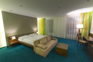 Posteľ alebo postele v izbe v ubytovaní Hotel Arkada