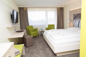 TV a/nebo společenská místnost v ubytování Hotel Gierer