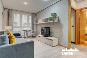 Televízia a/alebo spoločenská miestnosť v ubytovaní Apartamento Karri by SanSe Holidays