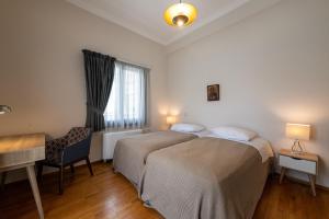 Postel nebo postele na pokoji v ubytování Angelinas Quarters - Kalamata Mediterranean Villas