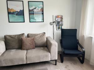 a living room with a couch and a chair at Ferienwohnung Bergoase - Todtnauberg, Feldberg in Todtnau