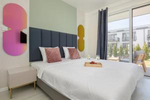 Ένα ή περισσότερα κρεβάτια σε δωμάτιο στο Apartamenty Paraiso by Noclegi Renters