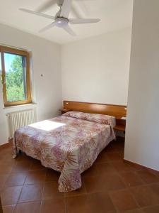 Postel nebo postele na pokoji v ubytování La Terrazza sul Castello