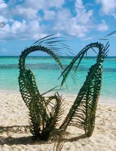 a sculpture of a palm tree on the beach at Kosinmyheart Apartment 11 & Studio10 in Kos Town