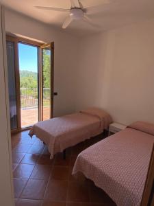 Postel nebo postele na pokoji v ubytování La Terrazza sul Castello