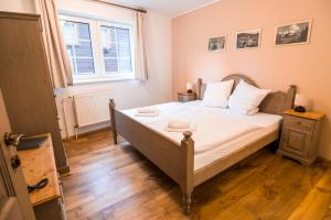 Łóżko lub łóżka w pokoju w obiekcie Grand Apartments Špindlerův Mlýn