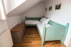 Łóżko lub łóżka w pokoju w obiekcie Grand Apartments Špindlerův Mlýn