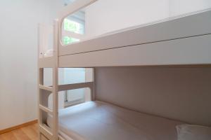 Postelja oz. postelje v sobi nastanitve Le Savenn - Appt vue mer 4p à Bénodet