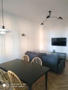 Televízia a/alebo spoločenská miestnosť v ubytovaní Apartament Sonet Mickiewicza Sopot