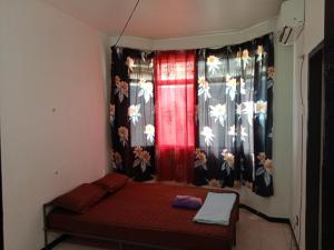 Postel nebo postele na pokoji v ubytování Homestay Idaman Penang