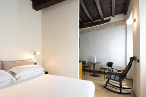 Giường trong phòng chung tại Camera Sibilla Residenza San Valerio